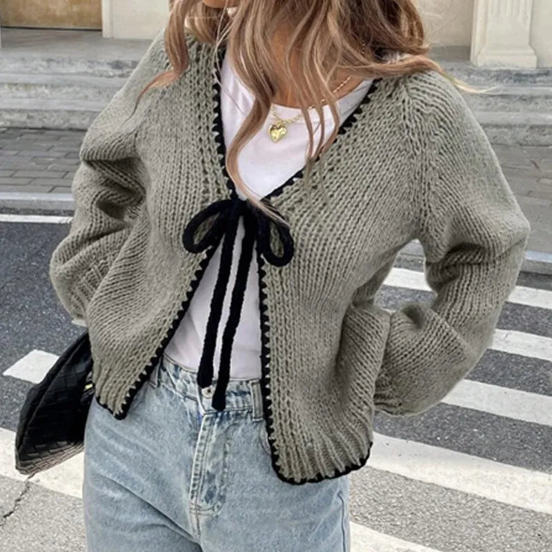 Women's gray loose-fit cardigan with long sleeves and white crochet flower details on the front.
