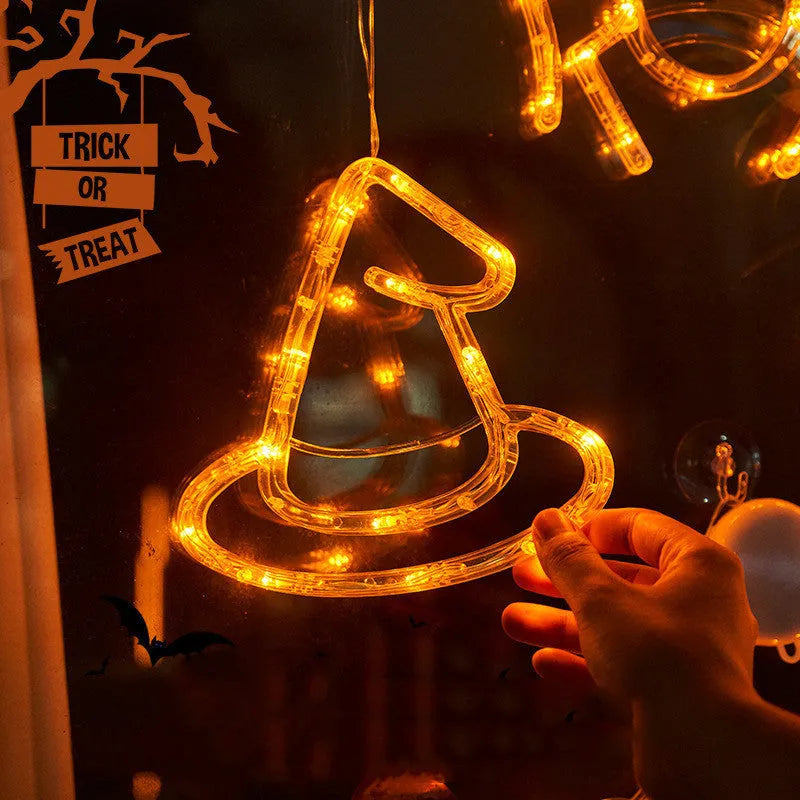 Halloween window hanging LED lights set with seven designs including spiders, pumpkins, and ghosts
