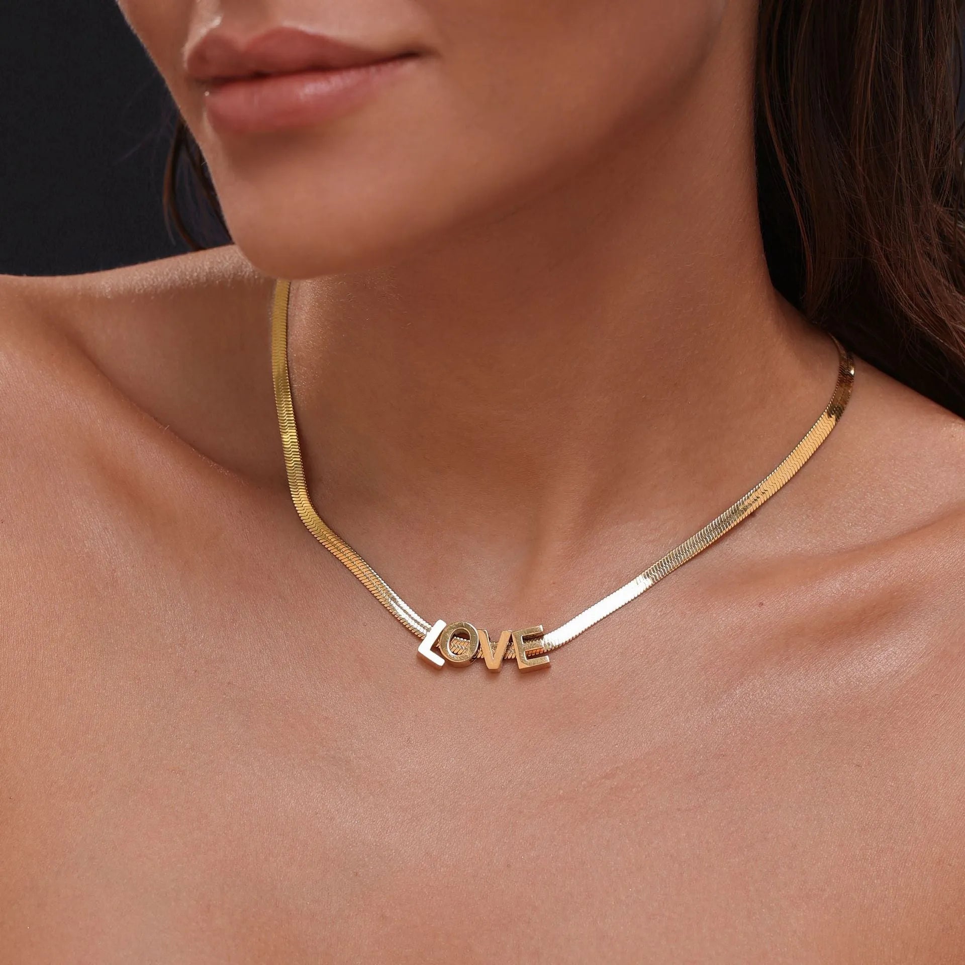 Gold titanium steel necklace with the letter A pendant on a 40.5cm blade-style chain.