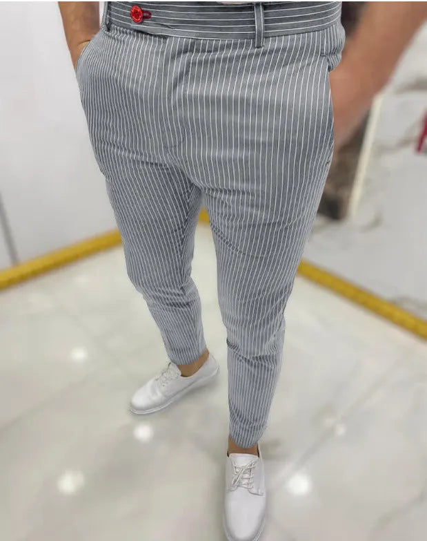 Thin striped slim casual polyester trousers for men in blue, showing mid rise waist and button fly