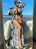 Women's floral pattern bikini set with long sleeve cover-up and banded briefs on a mannequin