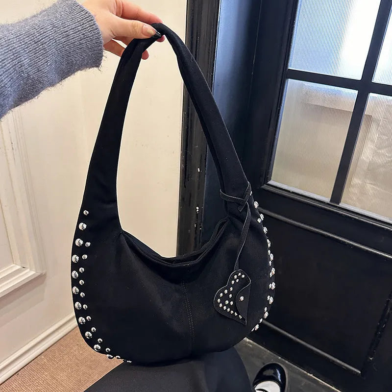 Women's soft plush underarm tote handbag in retro styling showing black, red, brown and green colour options