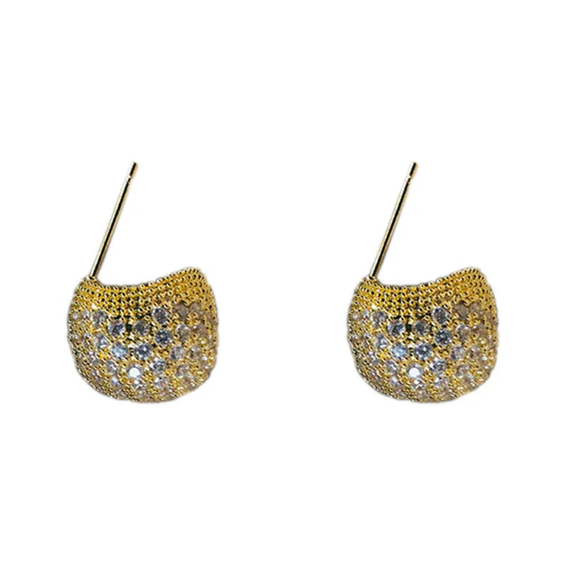 Geometric drop-shaped diamond ear clip earrings in gold and white colours with spherical elements