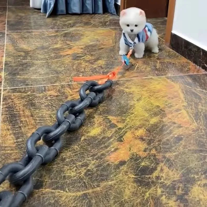 Simulated plastic dog leash prop in bronze colour for video parody content