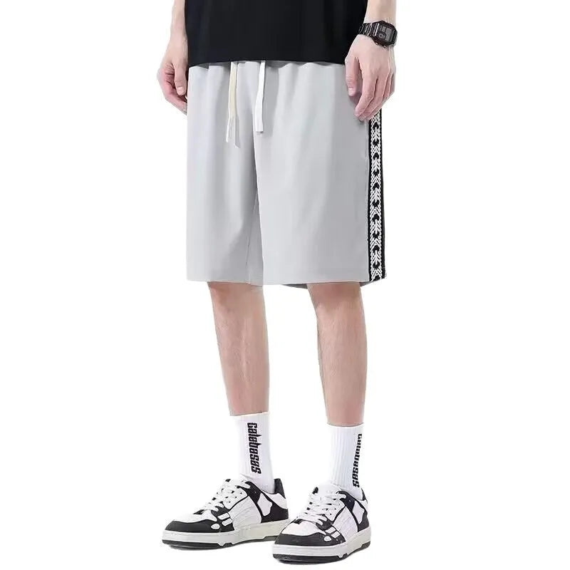 Men's loose-fit track pants in polyester fibre available in three colours and seven sizes
