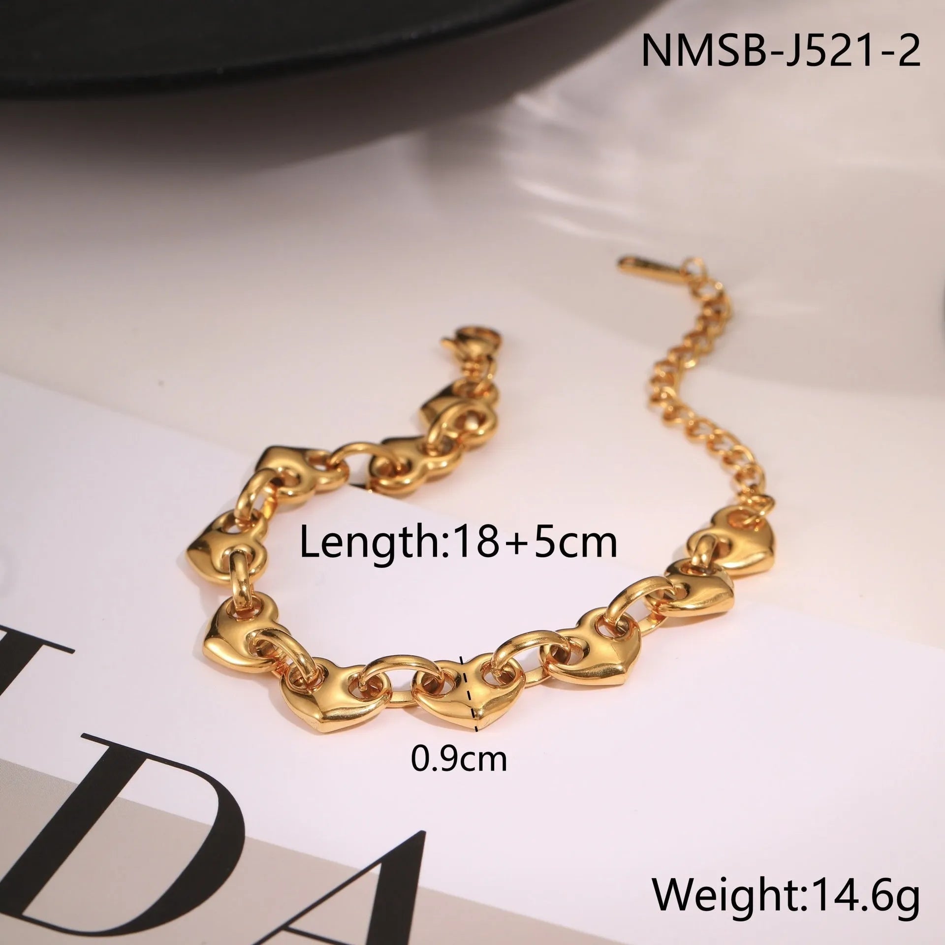 Women's hollowed-out heart bracelet in stainless steel with gold, steel, or colour block electroplated finish.