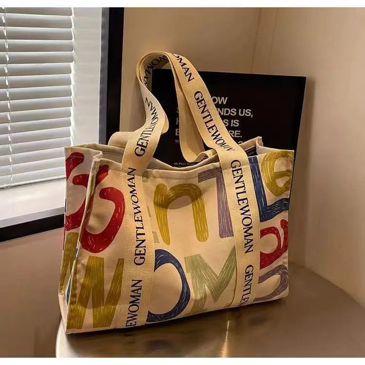 Canvas women's travel tote bag with printing elements and large capacity design