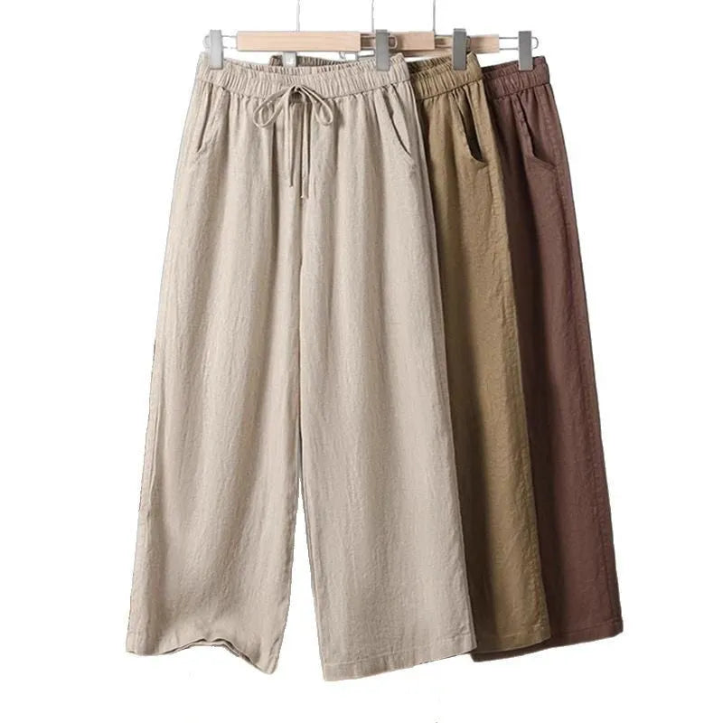 Women's straight-leg casual trousers in apricot colour with elastic drawstring waist