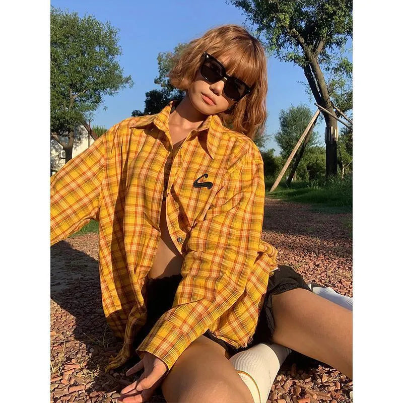 A loose-fitting dopamine yellow and black plaid cardigan-style shirt for men and women.