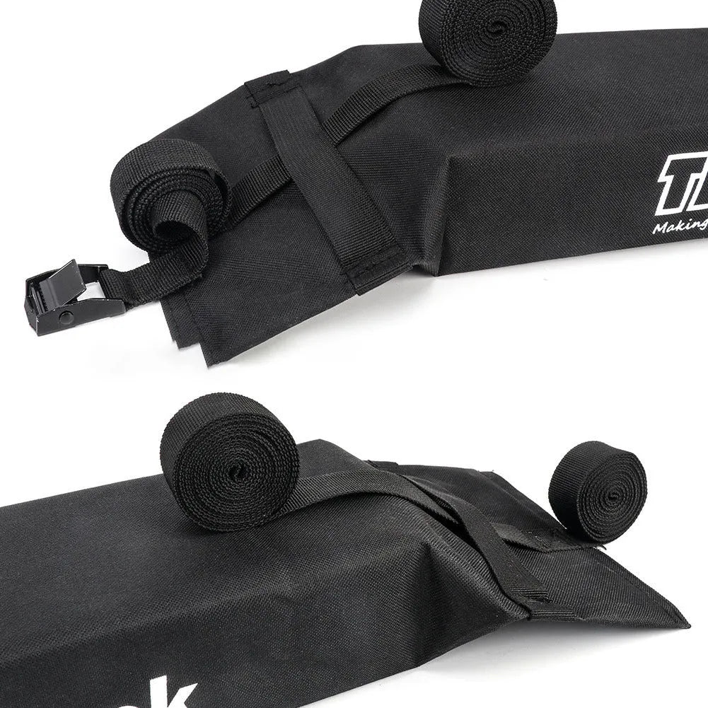 Folding black 600D oxford cloth roof rack on car with webbing straps and metal buckles