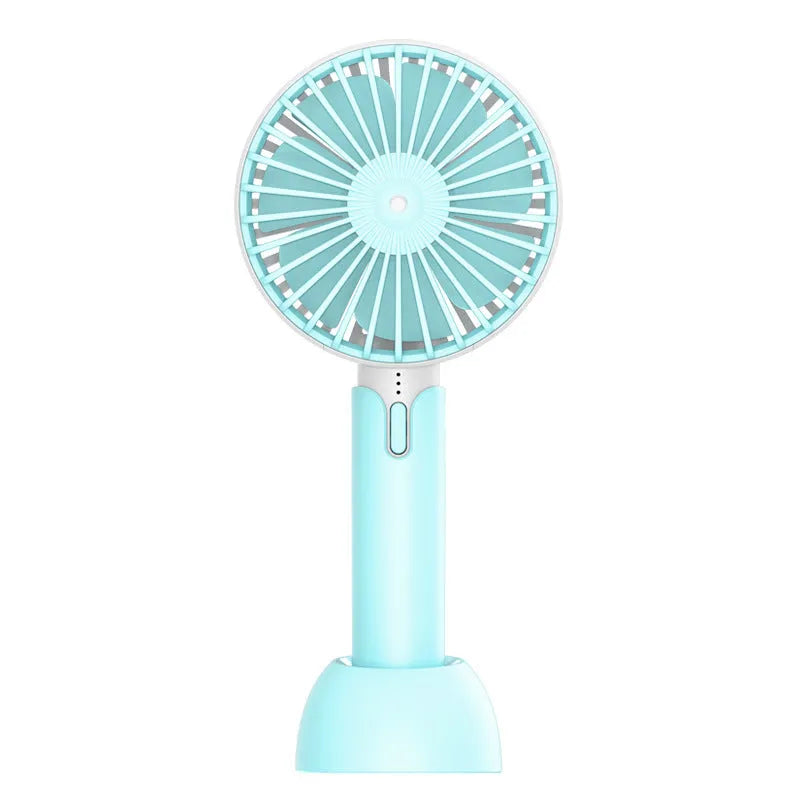 Blue handheld USB mini fan with three-speed buttons and oscillation function on a desk.