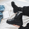 Men's black platform Dr. Martens ankle boots with a side zipper and frosted leather upper