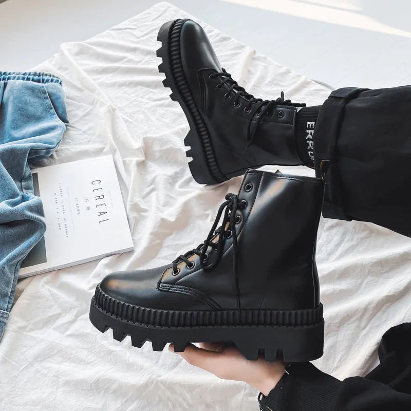 Men's black platform Dr. Martens ankle boots with a side zipper and frosted leather upper