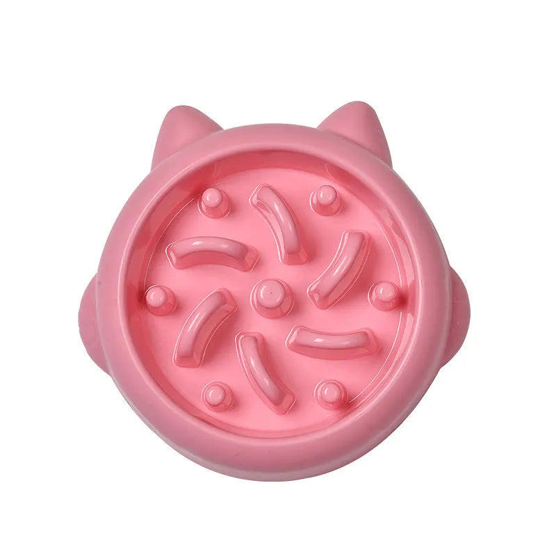 Green pet slow feeder bowl with raised internal ridges to slow eating for dogs and cats.