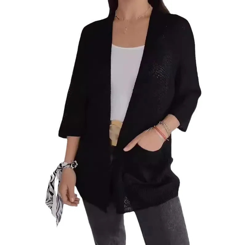 Women's waffle knit cardigan coat with nine-quarter length sleeves and pockets in army green.