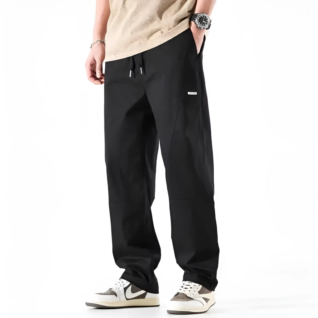 Cotton wide-leg trousers in milky white and black colours with loose fit design