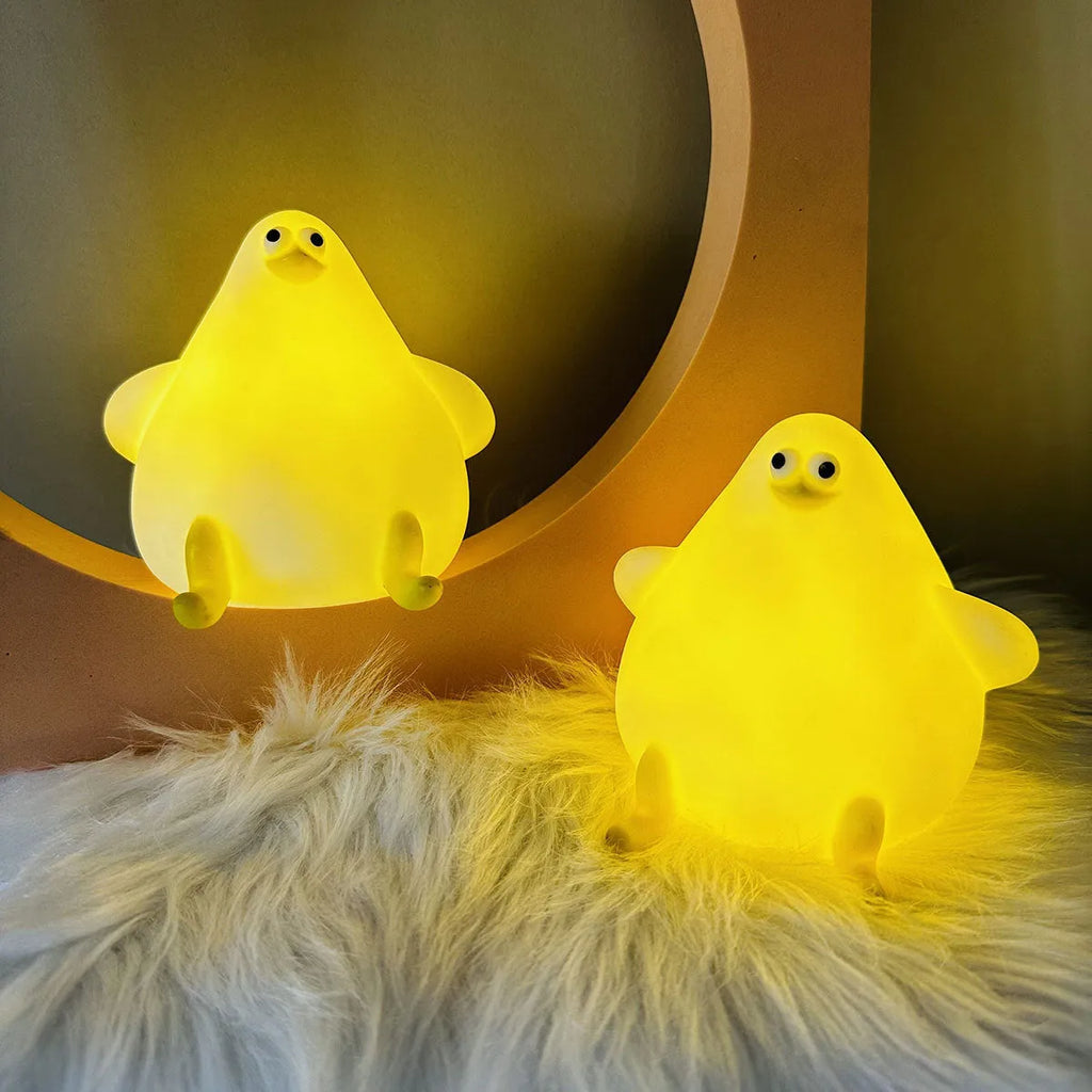 Cute cartoon silicone seagull night light USB rechargeable with soft glow on bedside table