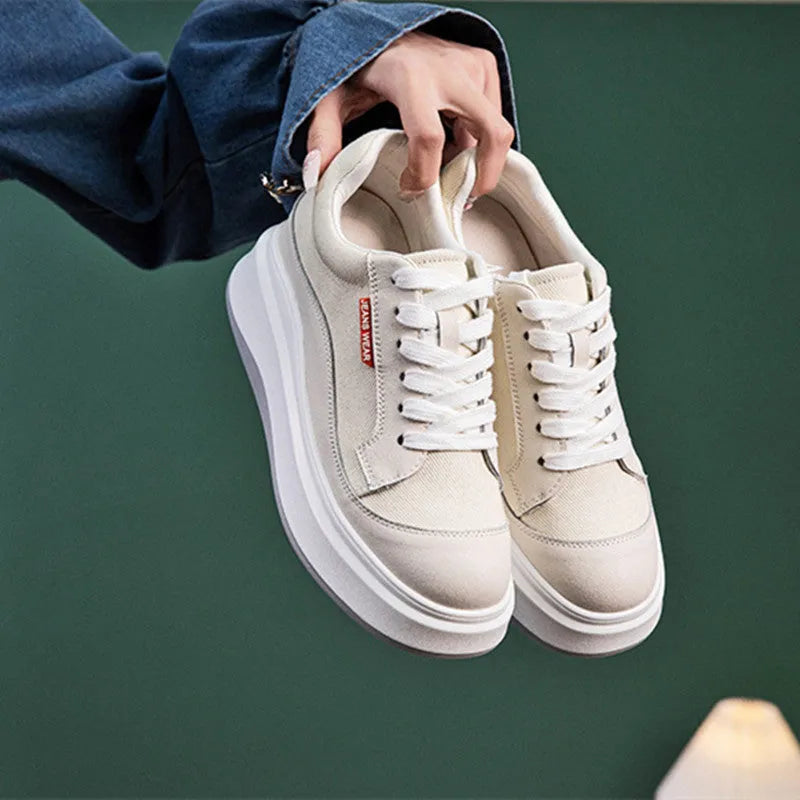 Women's thick-soled leather board shoes in pink and beige colours showing height-increasing design