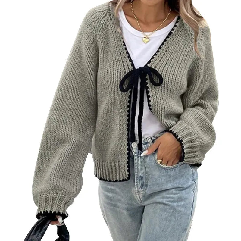 Women's gray loose-fit cardigan with long sleeves and white crochet flower details on the front.