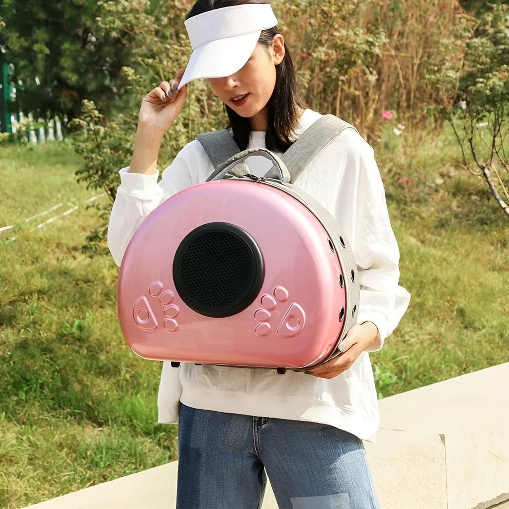 Transparent space capsule cat carrier in rose gold colour with hard-sided design
