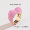 Three-dimensional heart-shaped enamel ring in zinc alloy, shown in choice of colours.