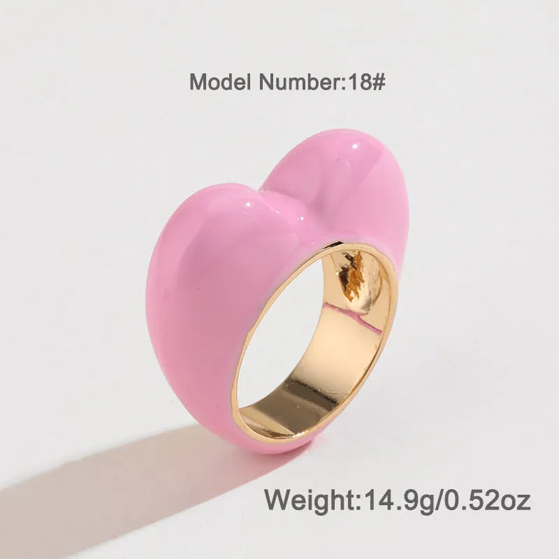 Three-dimensional heart-shaped enamel ring in zinc alloy, shown in choice of colours.