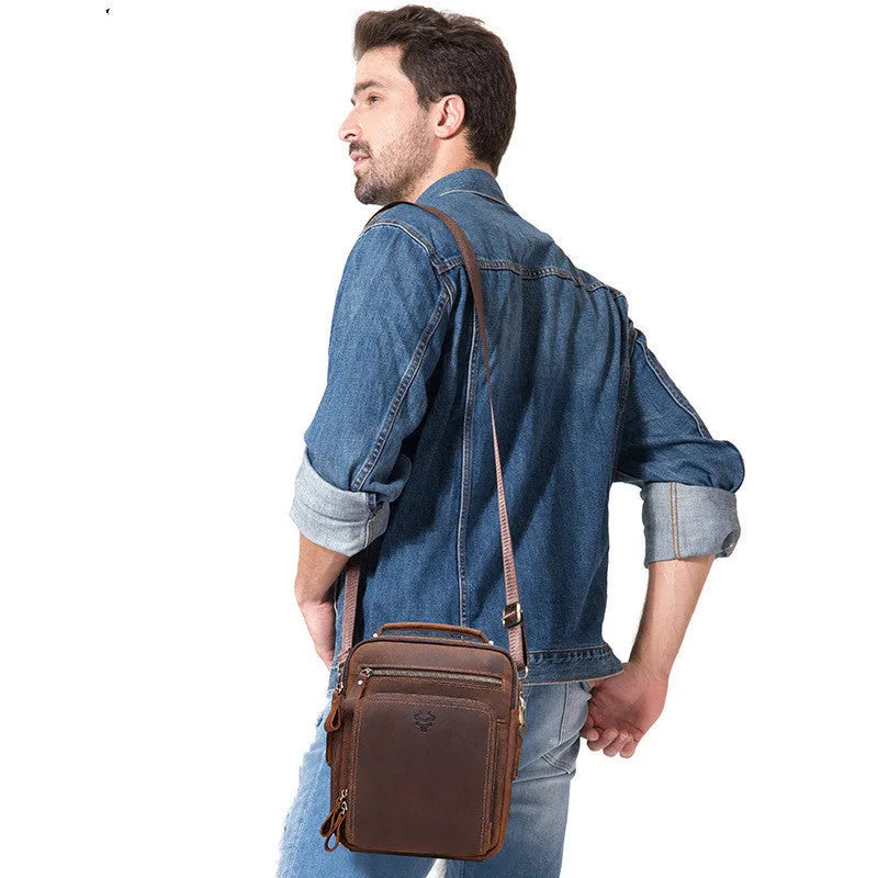 Men's brown genuine leather single-shoulder crossbody bag with sewing line detailing.