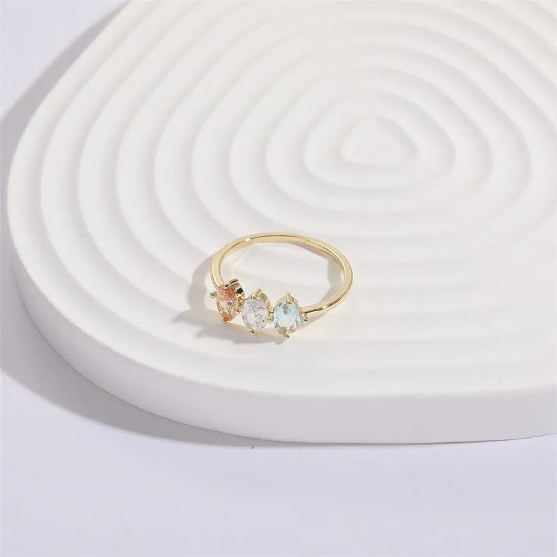 Geometric triangular copper women's ring with tricolour zircon stones and electroplated gold colour finish
