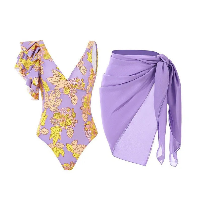 Women's solid colour one-piece swimsuit with spaghetti straps and a matching detachable skirt.