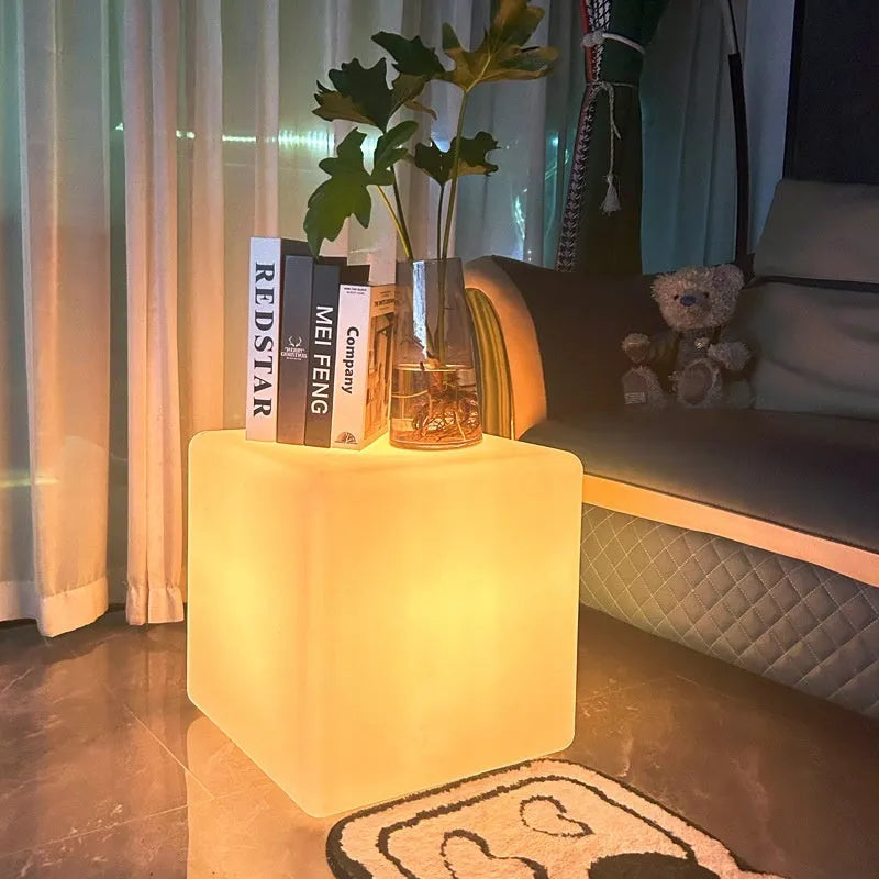 Modern square LED cube light stool in outdoor setting showing waterproof IP65 design