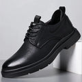 Men's black and brown leather sneaker with sewing line detail on a two-layer cowhide upper and rubber sole.