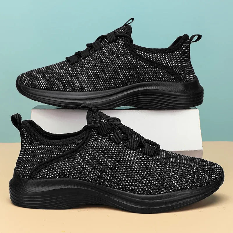 Women's low-top casual sneakers with breathable mesh upper and round toe in black colour