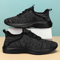Women's low-top casual sneakers with breathable mesh upper and round toe in black colour