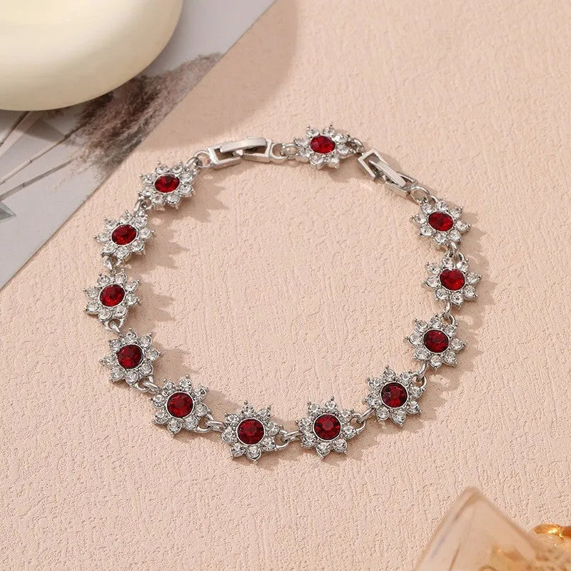 Close-up of a floral-shaped zinc alloy bracelet with an electroplated finish and crystal details.