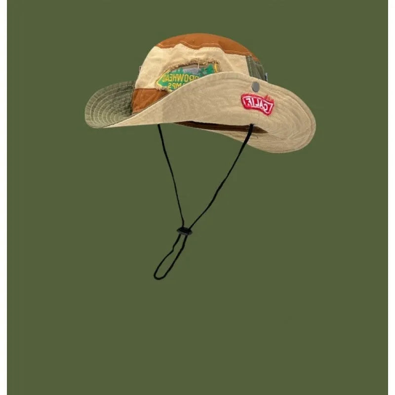 Army green cotton fisherman hat with patchwork design and flat top crown, folded to show storage feature