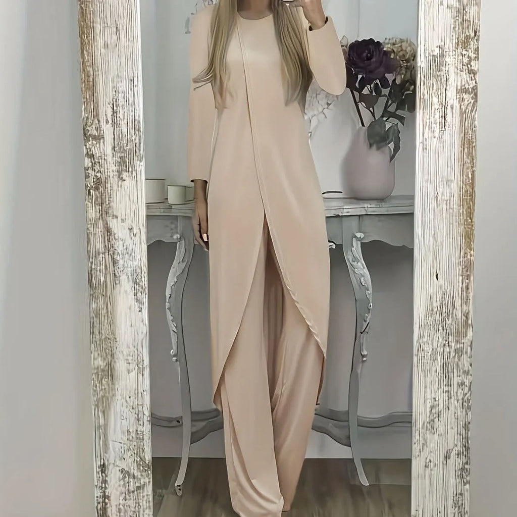 Women's black polyester two-piece lounge set with long sleeve top and loose trousers on a hanger.