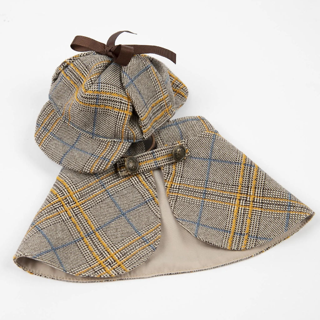 Camel-coloured cotton detective cloak for a dog on a mannequin, showing the hood with adjustable hat.
