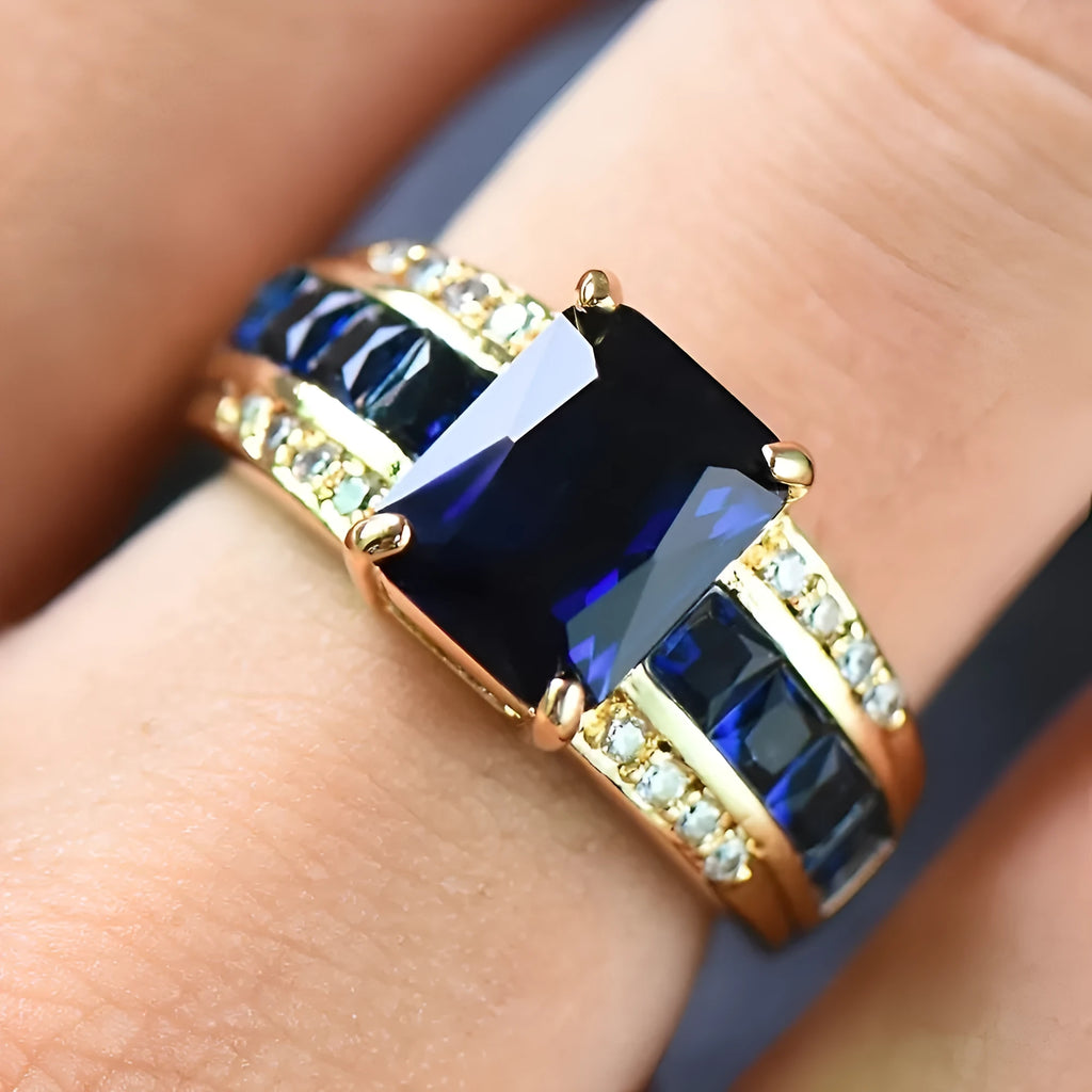 Zinc alloy personalised ring showing sunflower blue diamond and square-cut blue and purple zircon designs.