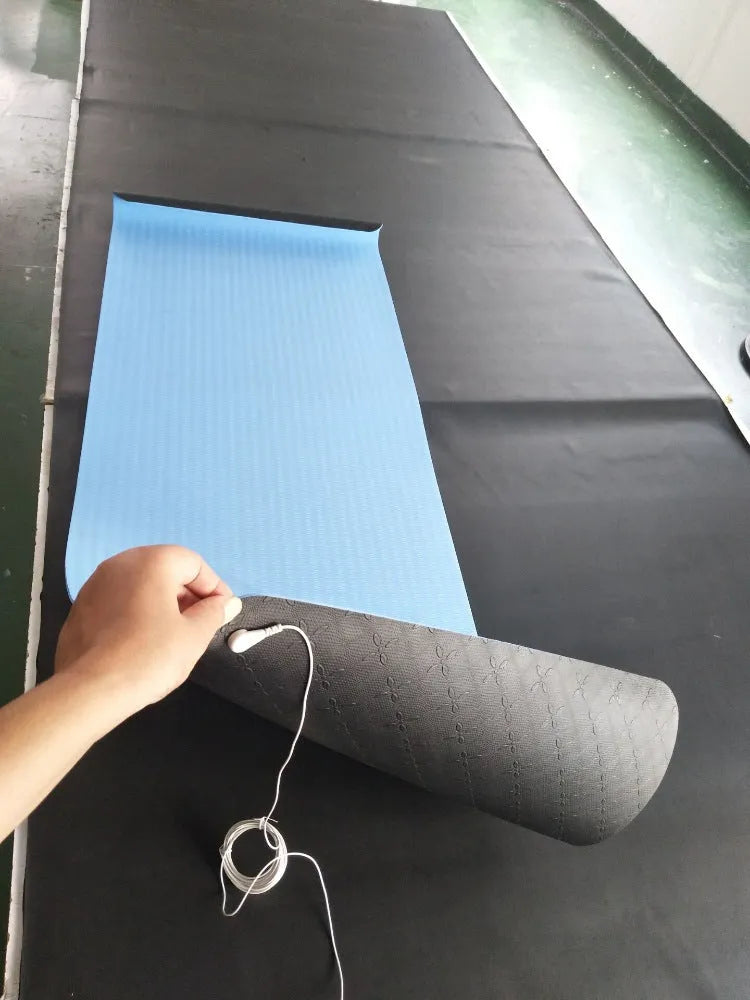 Blue conductive yoga mat with plants and flowers pattern, measuring 182x61cm with grounding wire