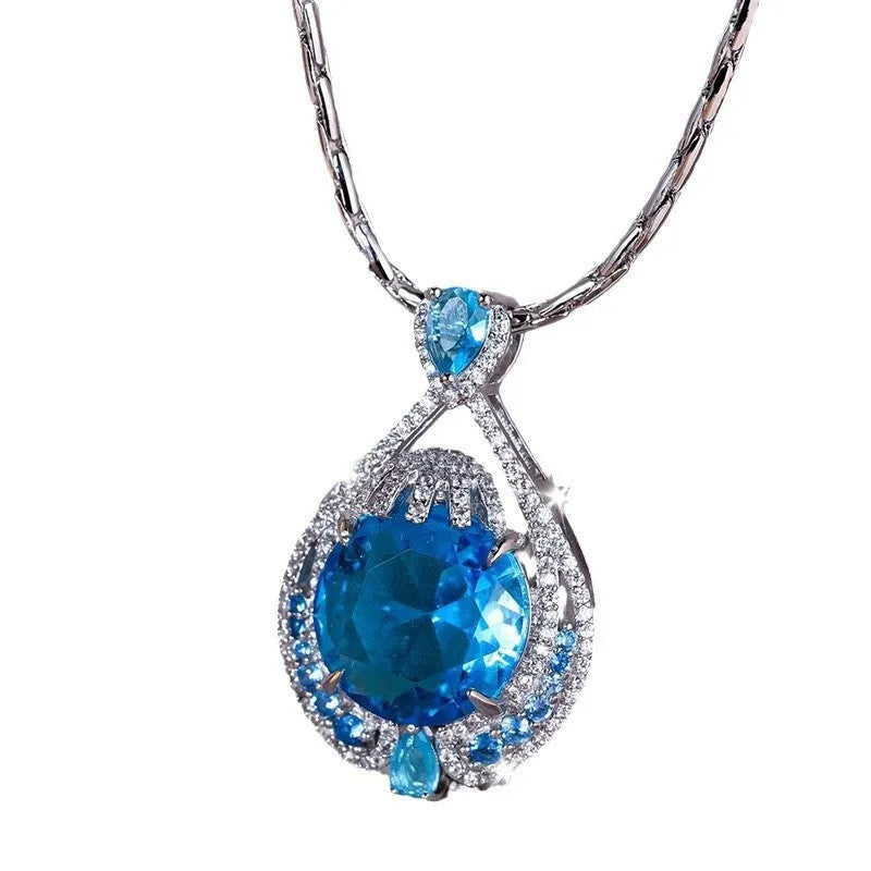 Women's bright blue crystal necklace with geometric fireworks-cut pendant on water wave chain