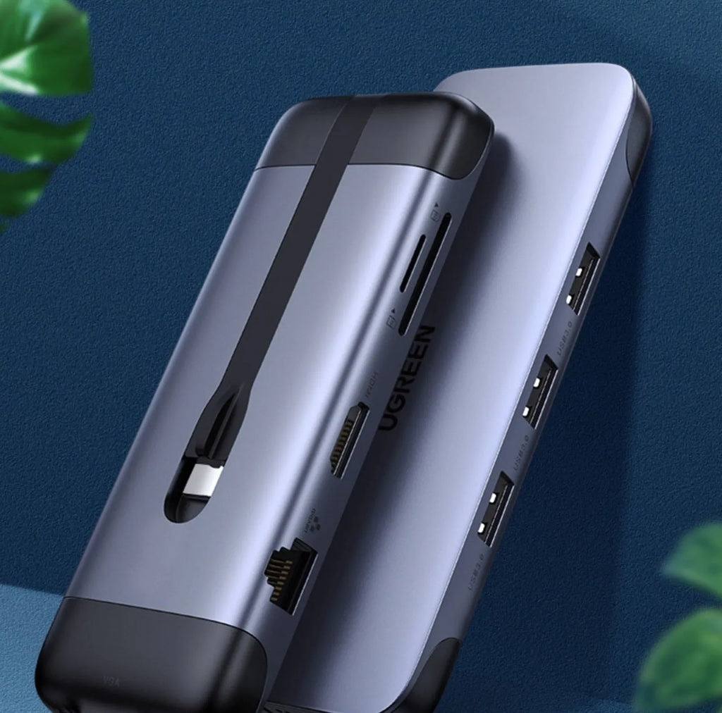 USB C docking station showing ports for HDMI, USB 3.0, PD charging, VGA, Ethernet, and card reader.