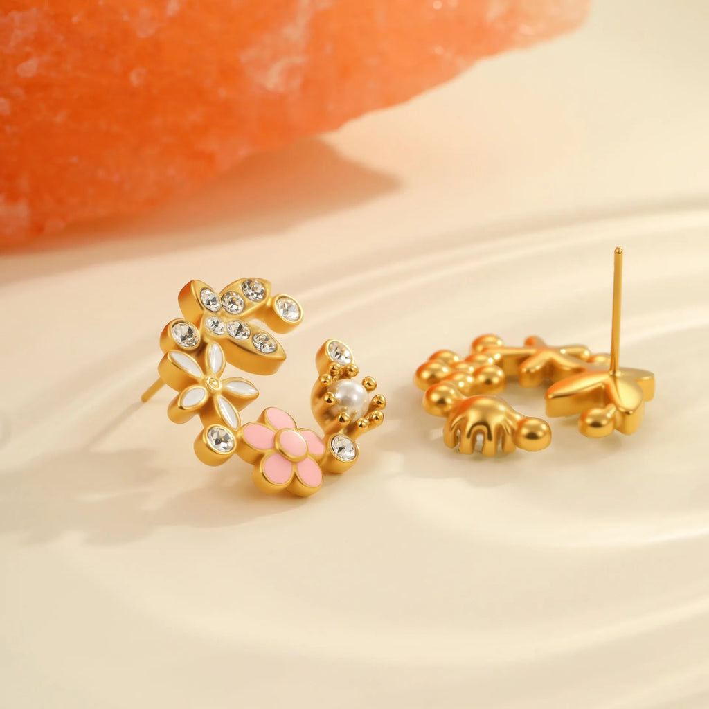 Stainless steel flower stud earrings with colourful oil petals on a white background.