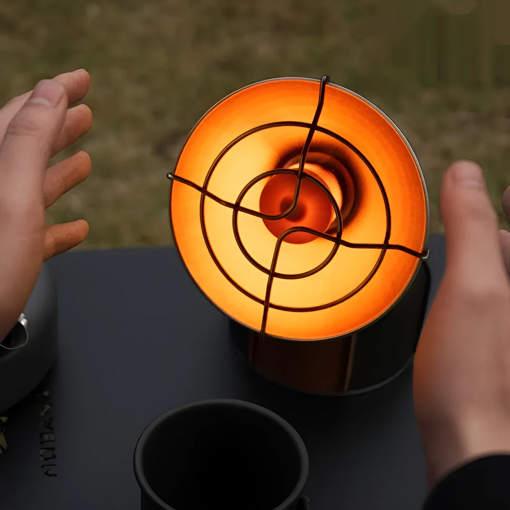 Black and orange portable heating stove for outdoor camping with automatic ignition