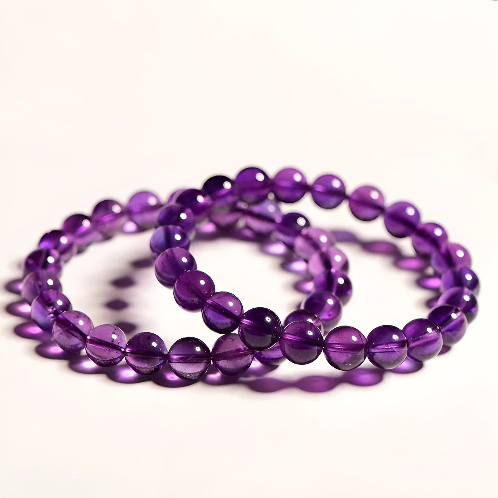 Natural amethyst Uruguay bracelet with scattered polished crystal beads in jiuya colour grades