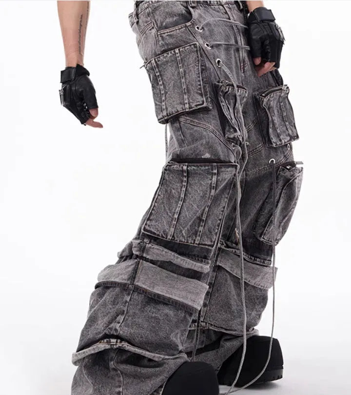 Grey distressed denim men's overalls with rope stitching detail on the front
