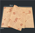 Stack of 28x38cm microwaveable food grade anti-oil Kraft baking paper sheets in English, newspaper, and retro styles
