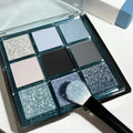 Mugeleen nine-colour eyeshadow palette showing blue smoked shade with matte shimmer diamond finishes