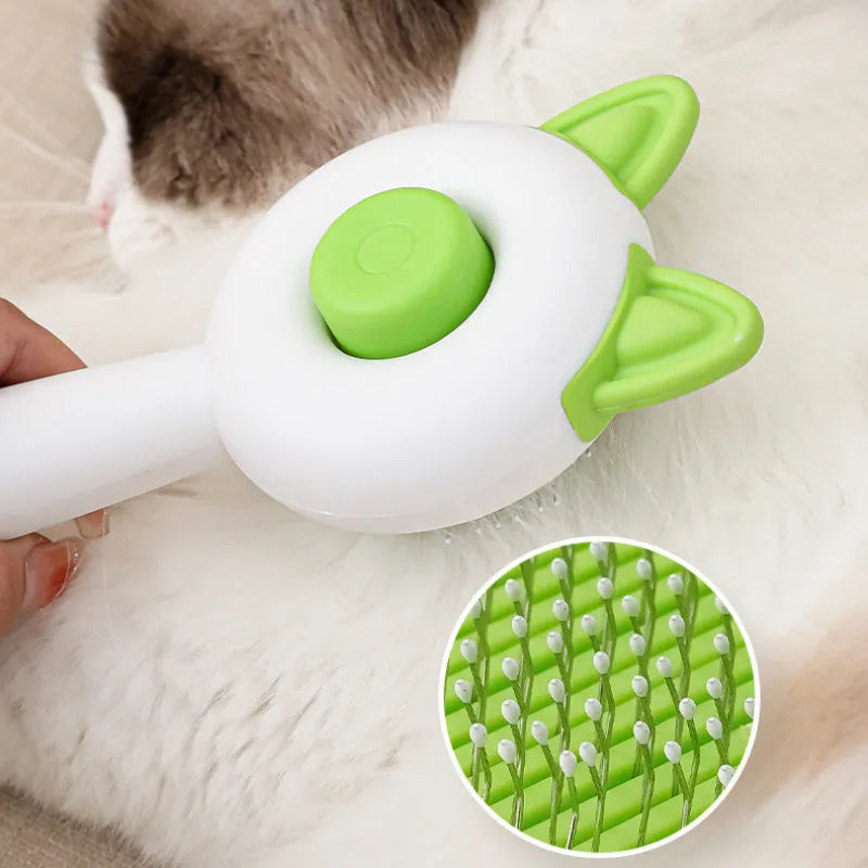 Circular greenish white pet grooming brush with stainless steel teeth and rubber massage nodules.