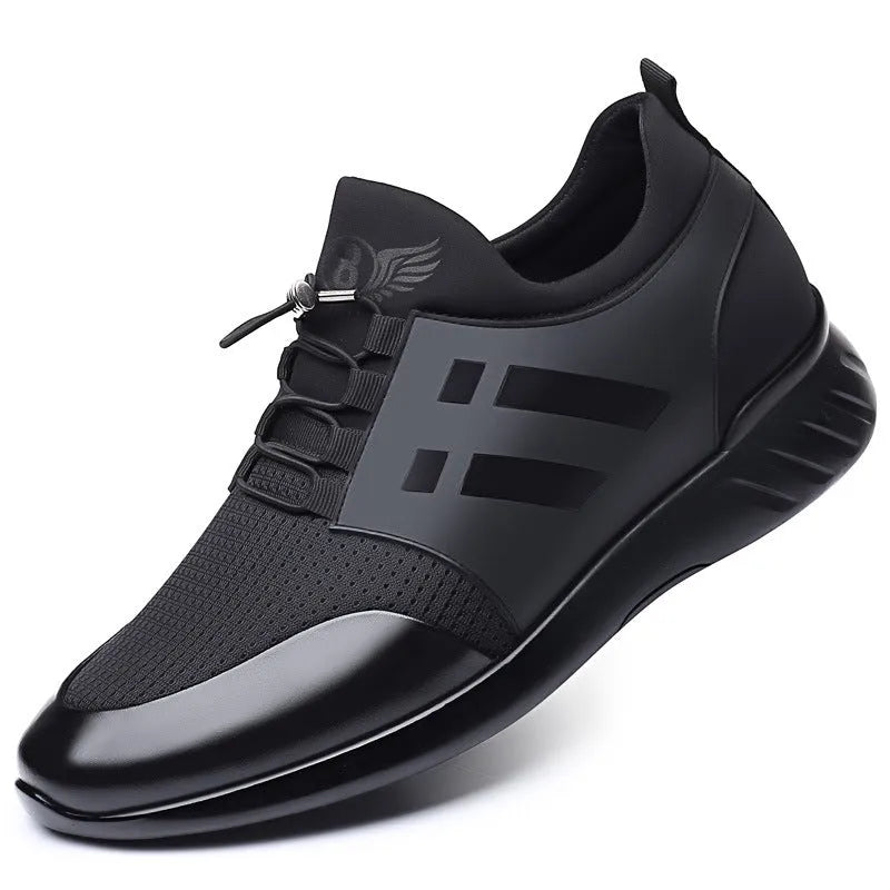 Men's black height increasing casual sneakers with chunky rubber sole and low top design.