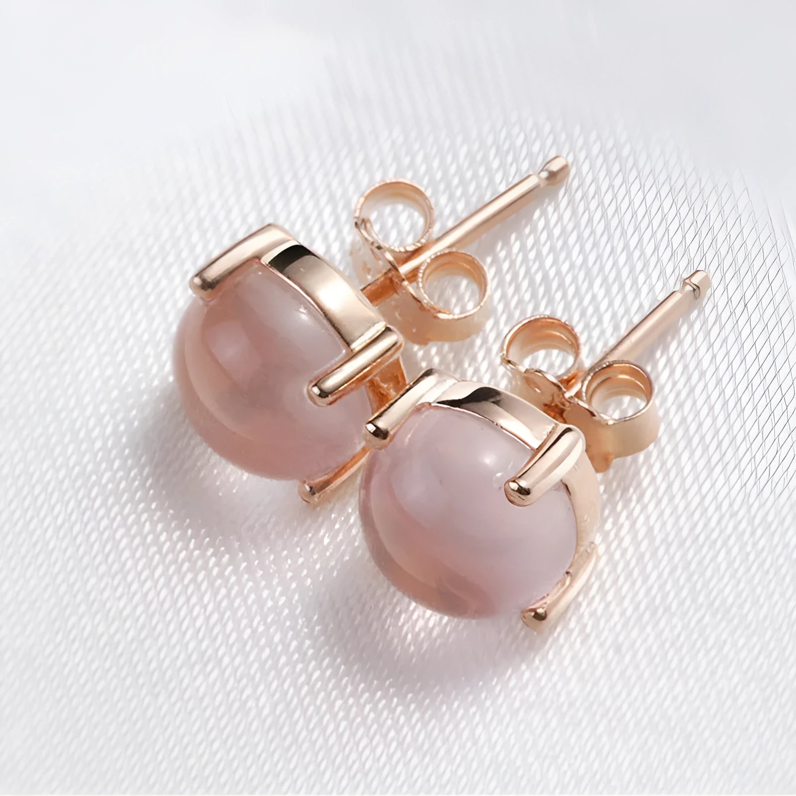 Women's rose gold plated silver earrings with synthetic quartz drop shape design